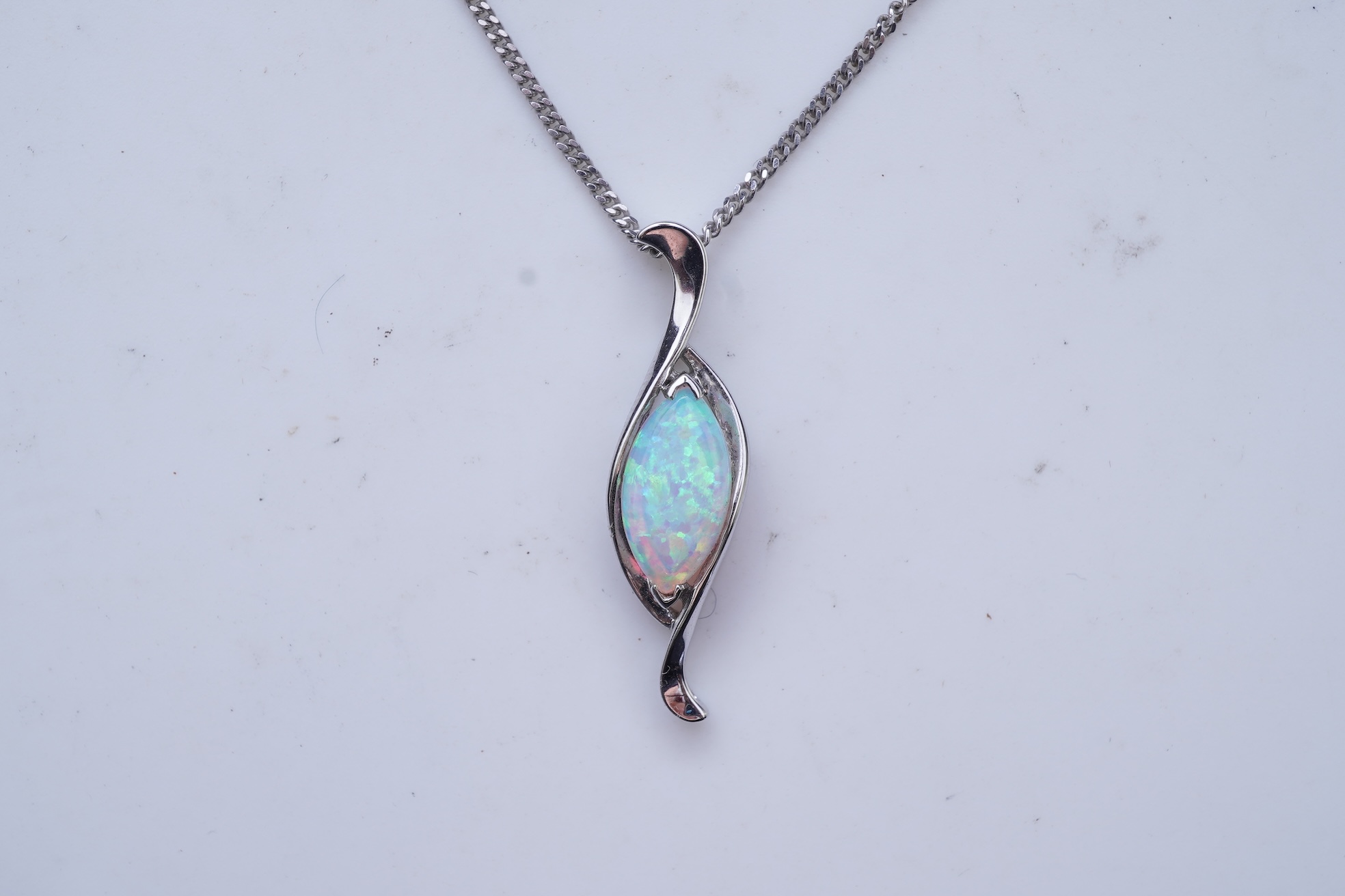 A synthetic opal demi-parure